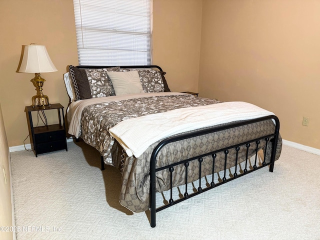 carpeted bedroom with baseboards