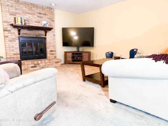 living area with a brick fireplace and light colored carpet