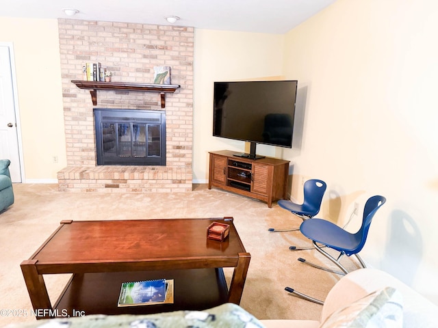 living room featuring a fireplace, baseboards, and carpet floors