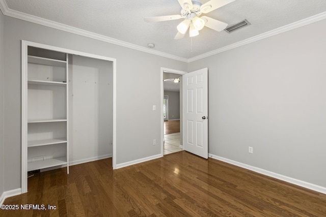 109 N Lake Cunningham Ave, Saint Johns, FL 32259 - unfurnished bedroom with baseboards, a textured ceiling, visible vents, and wood finished floors