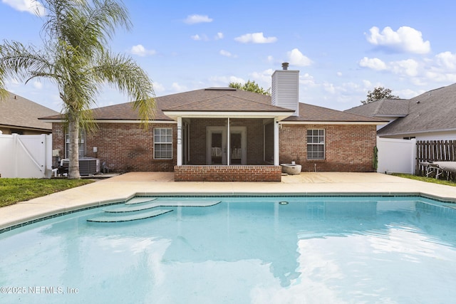 109 N Lake Cunningham Ave, Saint Johns, FL 32259 - view of pool with a patio, a sunroom, a fenced in pool, and fence