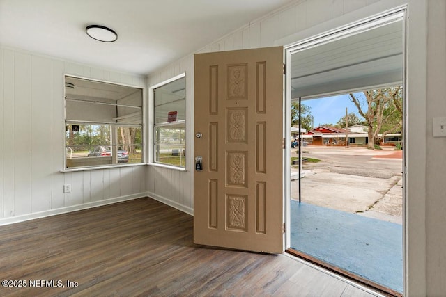 entryway with a healthy amount of sunlight, baseboards, and wood finished floors