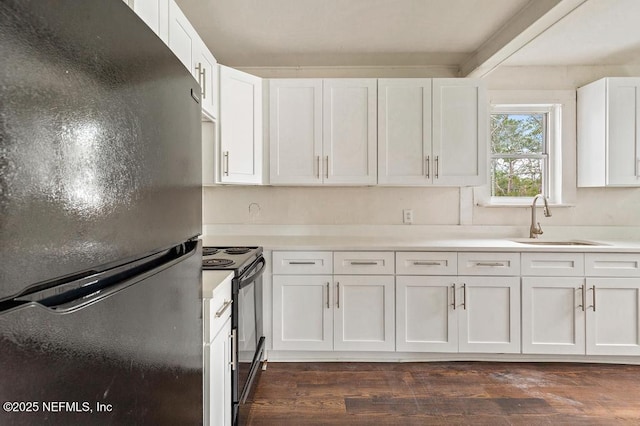 kitchen featuring dark wood finished floors, a sink, black appliances, white cabinets, and light countertops