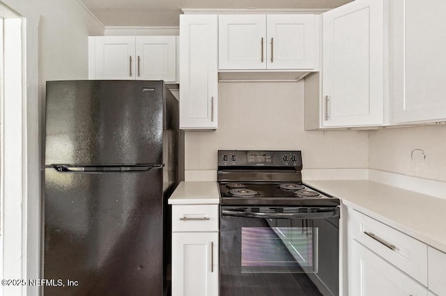 kitchen featuring white cabinets, black appliances, and light countertops