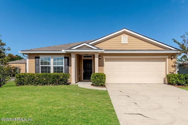 ranch-style home featuring an attached garage, concrete driveway, and a front yard