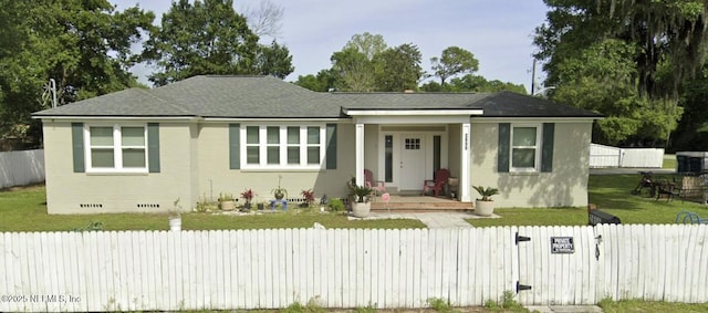 view of front of house featuring crawl space, brick siding, covered porch, and a fenced front yard