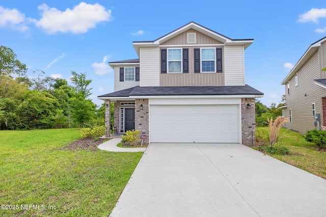 view of front of home with brick siding, driveway, an attached garage, and a front lawn