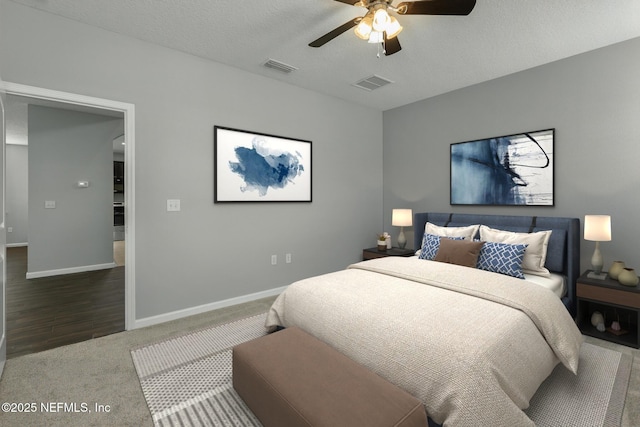 bedroom with visible vents, baseboards, and carpet flooring