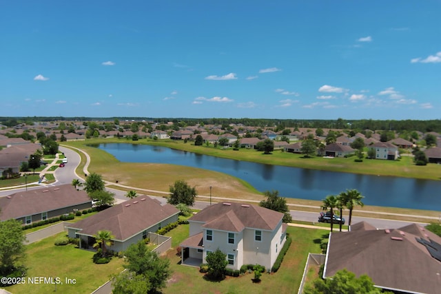 bird's eye view featuring a residential view and a water view