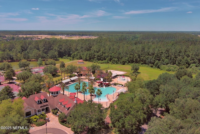 aerial view featuring a wooded view