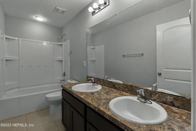 full bath with tile patterned floors, visible vents, a textured ceiling, and a sink