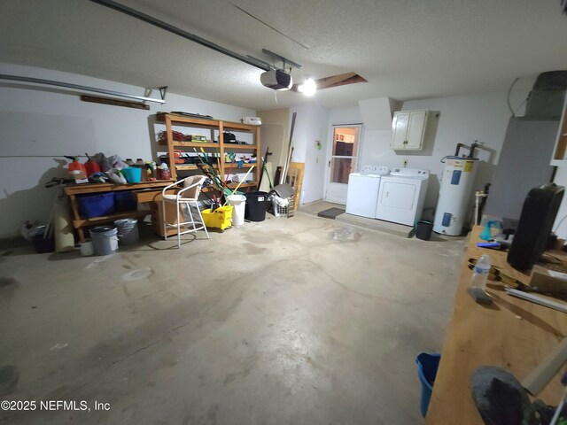 garage with a garage door opener, independent washer and dryer, and electric water heater