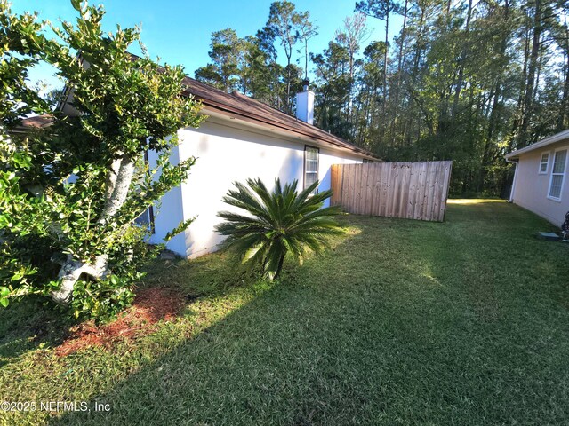 view of yard with fence