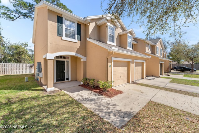 townhome / multi-family property featuring stucco siding, a front lawn, driveway, fence, and a garage