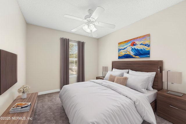 bedroom featuring baseboards, carpet, a ceiling fan, and a textured ceiling