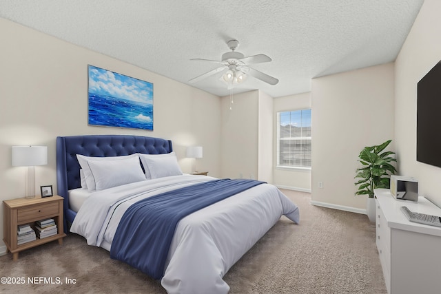 bedroom featuring baseboards, ceiling fan, a textured ceiling, and carpet