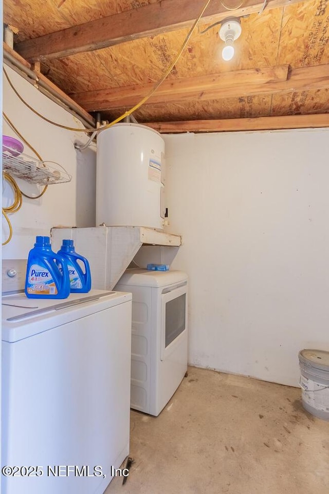 clothes washing area with washer and clothes dryer and laundry area