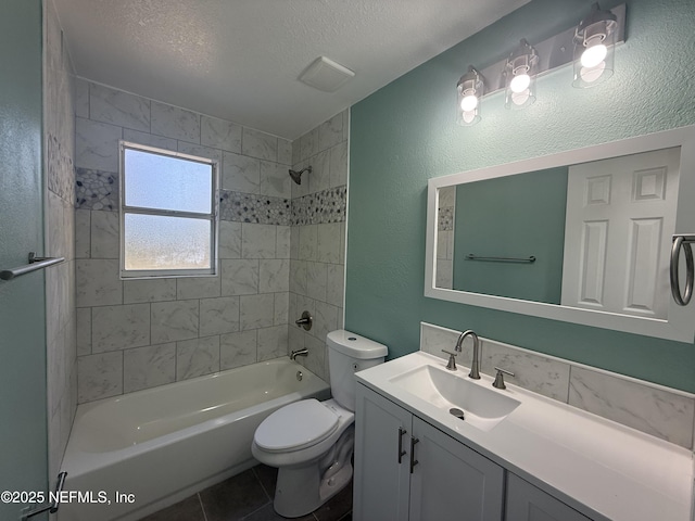 full bath with tub / shower combination, toilet, vanity, tile patterned floors, and a textured ceiling