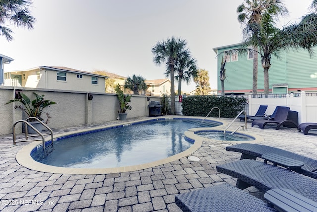 view of swimming pool featuring a patio, area for grilling, a fenced backyard, and a fenced in pool