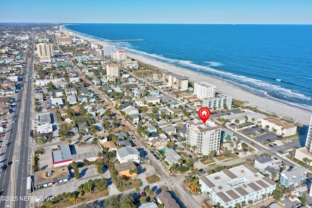 bird's eye view featuring a city view, a view of the beach, and a water view