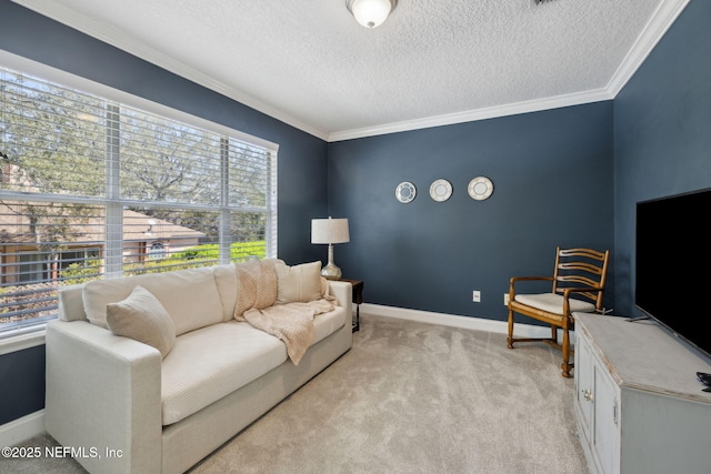 living room featuring light colored carpet, a textured ceiling, baseboards, and ornamental molding