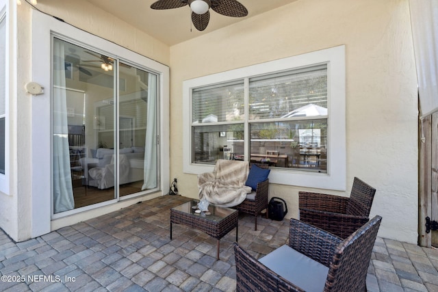 view of patio featuring ceiling fan