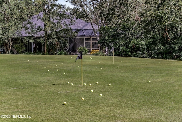 surrounding community featuring a lawn