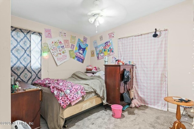 carpeted bedroom with a ceiling fan