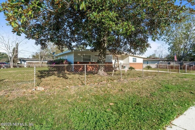 view of front of house featuring a front yard and fence