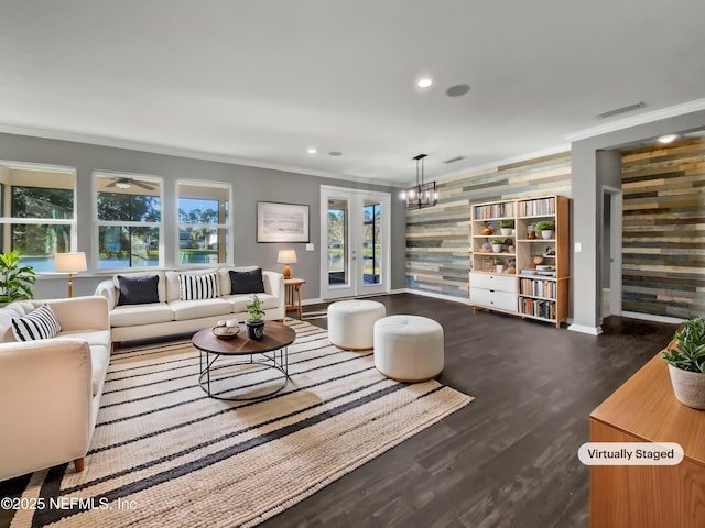 living room with recessed lighting, a healthy amount of sunlight, dark wood-style floors, and crown molding