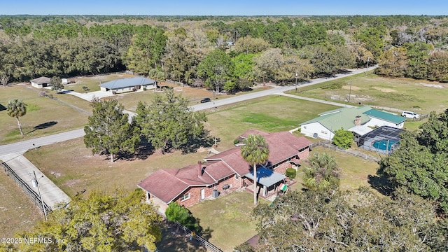 drone / aerial view with a view of trees