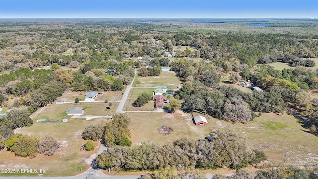 drone / aerial view with a view of trees