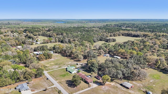 bird's eye view featuring a wooded view