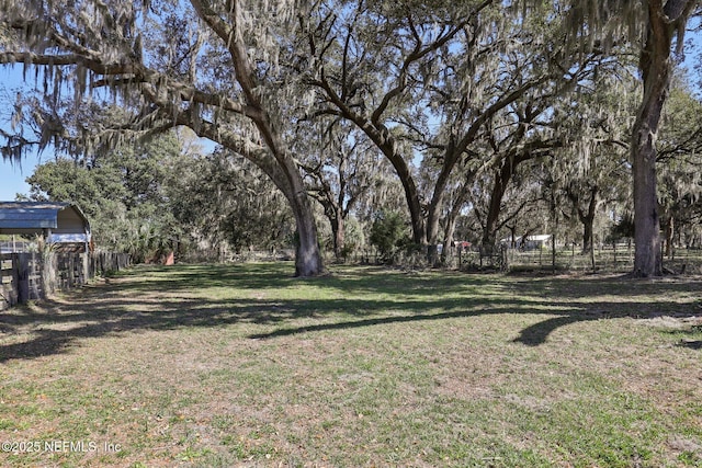 view of yard with fence