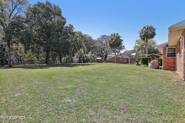 view of yard with fence