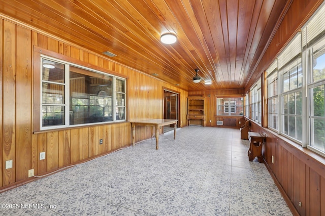 sunroom featuring wood ceiling