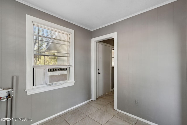 interior space featuring light tile patterned floors, cooling unit, baseboards, and ornamental molding