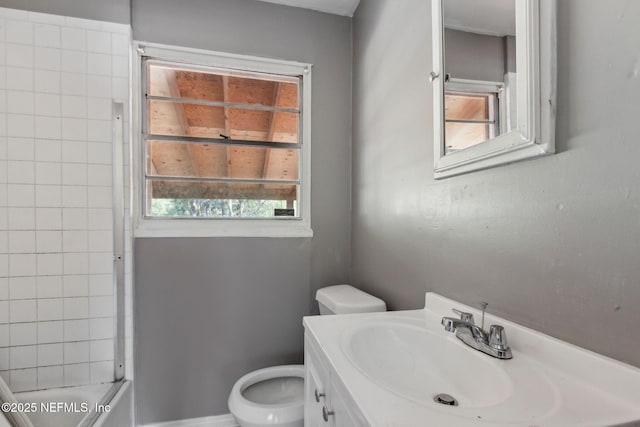 bathroom featuring shower / tub combination, toilet, and vanity