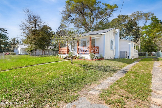 80 Anderson St, Saint Augustine, FL 32084 - view of front of house with a front yard, cooling unit, a fenced backyard, and covered porch