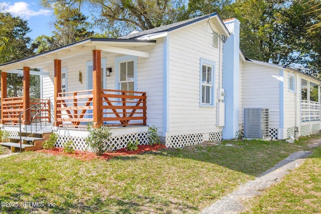 80 Anderson St, Saint Augustine, FL 32084 - exterior space featuring a porch, a yard, and a chimney
