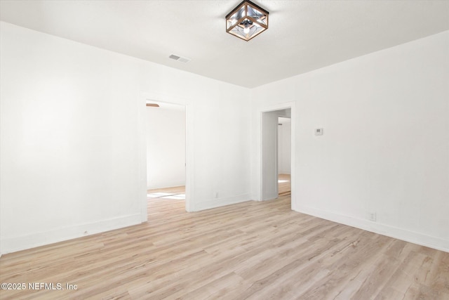 80 Anderson St, Saint Augustine, FL 32084 - empty room featuring light wood finished floors, visible vents, and baseboards