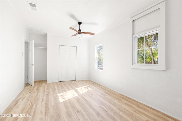 80 Anderson St, Saint Augustine, FL 32084 - unfurnished bedroom featuring a ceiling fan, wood finished floors, and visible vents
