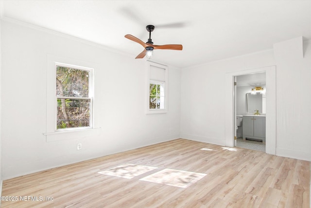 80 Anderson St, Saint Augustine, FL 32084 - unfurnished bedroom featuring ceiling fan, connected bathroom, wood finished floors, and crown molding