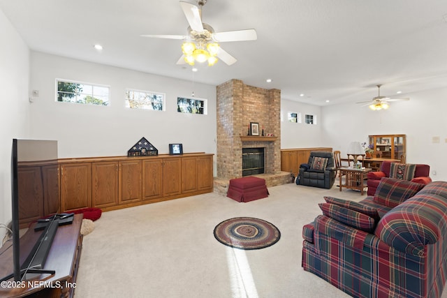 living area featuring recessed lighting, a fireplace, carpet floors, and ceiling fan