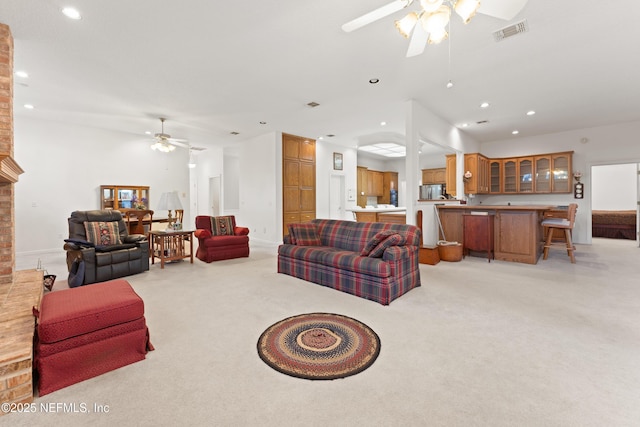 living area featuring recessed lighting, visible vents, light colored carpet, and ceiling fan