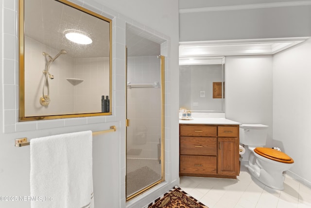 bathroom featuring tile patterned flooring, a shower stall, vanity, and toilet