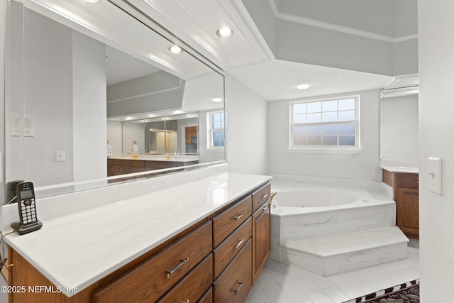 bathroom with a bath, recessed lighting, a healthy amount of sunlight, and vanity