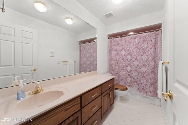 bathroom featuring visible vents, toilet, a textured ceiling, tile patterned flooring, and vanity