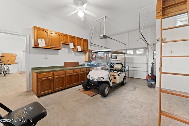 garage with a garage door opener and a ceiling fan