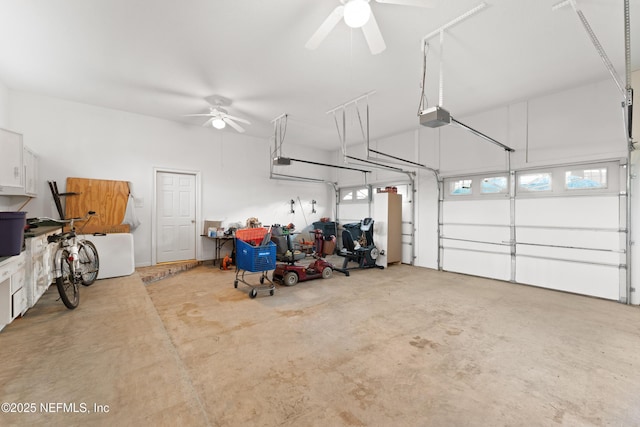 garage featuring a garage door opener and a ceiling fan